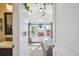 Bright main bedroom with vaulted ceiling, large windows, neutral decor and ensuite bathroom at 5415 S Delaware St, Littleton, CO 80120