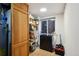 Functional storage room with shelving, freezer, and ample storage for household needs at 5415 S Delaware St, Littleton, CO 80120