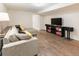 Finished basement featuring a comfortable sectional sofa and entertainment center at 2619 Mountain View Ave, Franktown, CO 80116
