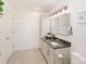 This bathroom offers a sleek vanity with stone counters and great lighting at 2619 Mountain View Ave, Franktown, CO 80116