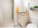 Neutrally decorated bathroom with a granite vanity top and a shower behind a glass door at 2619 Mountain View Ave, Franktown, CO 80116