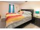 This bedroom features natural light and a unique decor at 2619 Mountain View Ave, Franktown, CO 80116