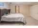 Comfortable bedroom with a patterned comforter and plenty of natural light at 2619 Mountain View Ave, Franktown, CO 80116