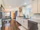 Bright kitchen featuring white cabinets, stainless appliances, and natural light at 2619 Mountain View Ave, Franktown, CO 80116
