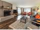 Bright living room featuring fireplace, hardwood floors, and natural light at 2619 Mountain View Ave, Franktown, CO 80116