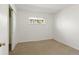 Cozy bedroom featuring neutral carpet and a window offering natural light at 2565 Gray St, Edgewater, CO 80214