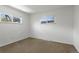 Bright bedroom with carpet and two windows providing views of the outdoors at 2565 Gray St, Edgewater, CO 80214