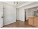 Dining room featuring wood flooring, natural light, and simple chandelier at 2565 Gray St, Edgewater, CO 80214