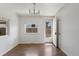 Dining room featuring wood flooring, natural light, and simple chandelier at 2565 Gray St, Edgewater, CO 80214