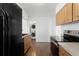 Efficient kitchen featuring modern appliances and light wood cabinetry at 2565 Gray St, Edgewater, CO 80214