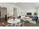 Bright living room features vaulted ceilings, modern décor, and wood flooring at 2565 Gray St, Edgewater, CO 80214