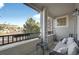 Inviting balcony area featuring seating, a small table, and views of the neighborhood at 479 Black Feather Loop # 311, Castle Rock, CO 80104