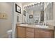 Bright bathroom featuring double sinks, a large mirror, and ample counter space at 479 Black Feather Loop # 311, Castle Rock, CO 80104