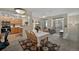 Inviting dining area with a floral centerpiece, seamlessly flowing into the kitchen and living room at 479 Black Feather Loop # 311, Castle Rock, CO 80104