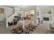 Cozy dining area showcasing a fireplace, open staircase and seamless flow to a well-lit kitchen at 479 Black Feather Loop # 311, Castle Rock, CO 80104