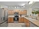 Well-lit kitchen featuring stainless steel appliances, ample cabinet space, and sleek countertops at 479 Black Feather Loop # 311, Castle Rock, CO 80104