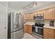 Well-equipped kitchen with stainless steel appliances and ample cabinetry for storage and food prep at 479 Black Feather Loop # 311, Castle Rock, CO 80104
