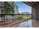 Covered balcony view overlooking well-maintained landscaping and parking at 2575 S Syracuse Way # B101, Denver, CO 80231
