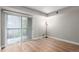 Bright bedroom with sliding glass door to the balcony at 2575 S Syracuse Way # B101, Denver, CO 80231