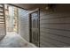 View of the apartment entrance, showcasing the door numbered 101 with wood siding at 2575 S Syracuse Way # B101, Denver, CO 80231
