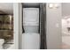 Convenient laundry closet with stacked washer and dryer unit at 2575 S Syracuse Way # B101, Denver, CO 80231
