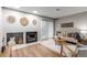 Inviting living room features a fireplace and decorative wall art, offering a cozy and stylish ambiance at 2575 S Syracuse Way # B101, Denver, CO 80231