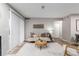 Bright living area featuring a cozy sofa, stylish decor, and sliding glass doors at 2575 S Syracuse Way # B101, Denver, CO 80231