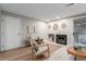 Inviting living room with a fireplace, complemented by a comfortable rocking chair at 2575 S Syracuse Way # B101, Denver, CO 80231