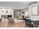 Cozy living room featuring a fireplace and sliding door to a patio at 2575 S Syracuse Way # B101, Denver, CO 80231