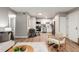 Open-concept living space flows into kitchen, complete with modern stainless steel appliances and dining area at 2575 S Syracuse Way # B101, Denver, CO 80231