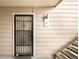 Secured entrance with decorative metal door and unit number, offering both security and style at 4896 S Dudley St # 6-5, Littleton, CO 80123