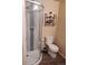 Compact bathroom features a glass-enclosed shower and modern fixtures at 6406 Silver Mesa Dr # F, Highlands Ranch, CO 80130