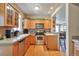 Traditional kitchen with wooden cabinets, stainless steel appliances, and granite countertops at 6406 Silver Mesa Dr # F, Highlands Ranch, CO 80130
