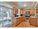 Well-appointed kitchen with stainless steel appliances and sliding door to outdoor space at 6406 Silver Mesa Dr # F, Highlands Ranch, CO 80130