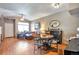 Open-concept living room featuring wood floors and bright, natural light at 6406 Silver Mesa Dr # F, Highlands Ranch, CO 80130