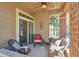 Relaxing outdoor patio with wicker furniture and charming decor at 6406 Silver Mesa Dr # F, Highlands Ranch, CO 80130