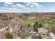 Aerial view of the neighborhood with the Denver skyline in the distance at 930 Reed Ct, Lakewood, CO 80214