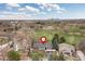 Expansive home with lush green lawn with the city skyline in the distance at 930 Reed Ct, Lakewood, CO 80214