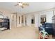 Large bedroom featuring a ceiling fan, bathroom, and mirrored closet doors at 930 Reed Ct, Lakewood, CO 80214