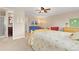 Bright bedroom with connecting bathroom and comfortable seating area at 930 Reed Ct, Lakewood, CO 80214