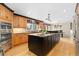 Spacious kitchen with custom cabinets, granite countertops, and a large center island at 930 Reed Ct, Lakewood, CO 80214