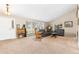 Spacious living room with hardwood floors, ample natural light, and comfortable seating arrangement at 930 Reed Ct, Lakewood, CO 80214