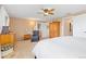 Another view of the main bedroom, featuring a ceiling fan and ensuite bath access at 930 Reed Ct, Lakewood, CO 80214