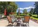Inviting outdoor patio area with a fire pit, comfortable seating, and a beautiful view of the surrounding landscape at 930 Reed Ct, Lakewood, CO 80214