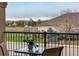 Balcony view of a playground with green space and a mountain backdrop in the distance at 1122 Olympia Ave # 12H, Longmont, CO 80504