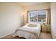 Bright bedroom with a large window and a cozy aesthetic at 1122 Olympia Ave # 12H, Longmont, CO 80504