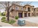 Stunning townhome with stone accents, three-car garage, and manicured front yard, offering curb appeal at 1122 Olympia Ave # 12H, Longmont, CO 80504