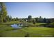 Picturesque aerial view of neighborhood pond and golf course at 750 S Alton Way # 8C, Denver, CO 80247