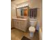 Bathroom features a combination tub/shower and updated vanity at 750 S Alton Way # 8C, Denver, CO 80247