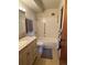 Bright bathroom featuring a marble-topped vanity and tiled shower at 750 S Alton Way # 8C, Denver, CO 80247